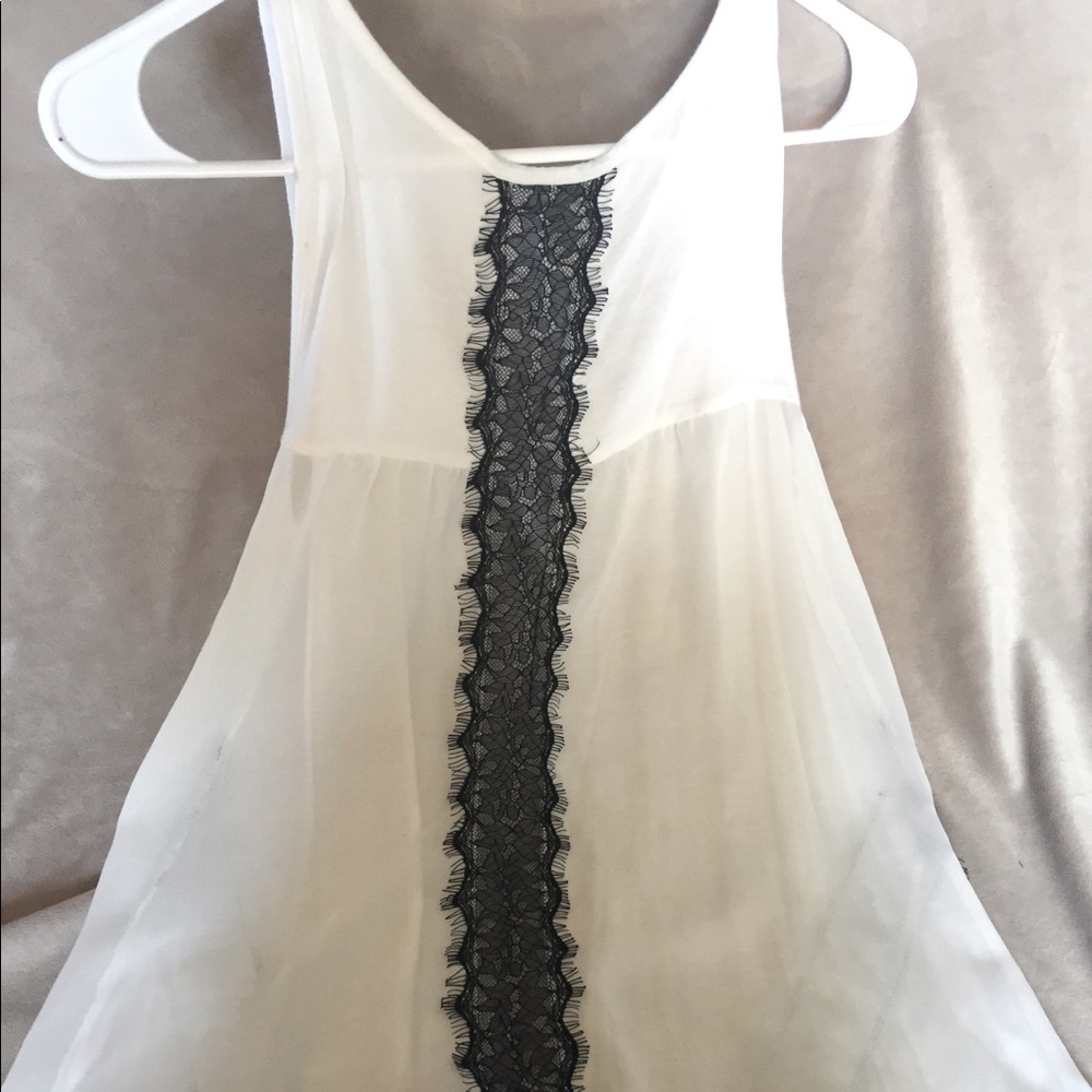 Sheer tank with lace details.